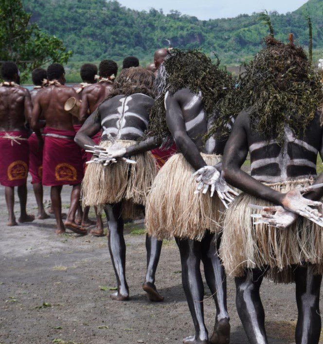 Colorful Ugandan cultural festival with traditional dancers in vibrant attire performing to rhythmic drumming and joyful community celebrations.