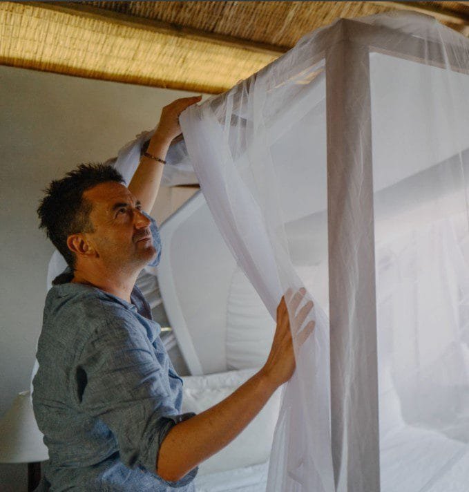 Mosquito nets providing protection against malaria during a safari, ensuring a safe and comfortable night’s sleep