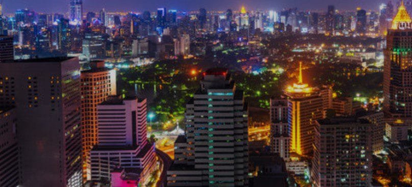 A vibrant view of Nairobi, Kenya's bustling capital, showcasing its skyline, busy streets, and urban atmosphere