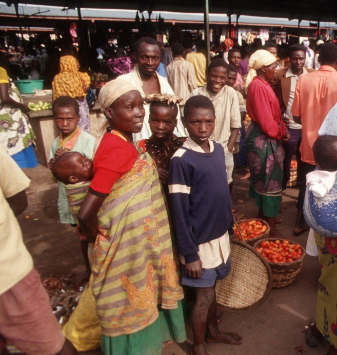 A variety of delicious street food options in Rwanda, including grilled meat, fried snacks, and fresh fruits.