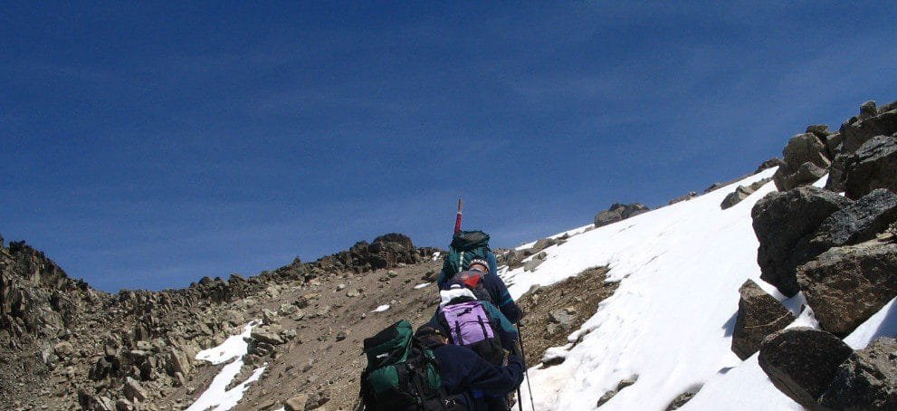 Majestic view of Mount Kenya with snow-capped peaks and lush greenery at lower altitudes