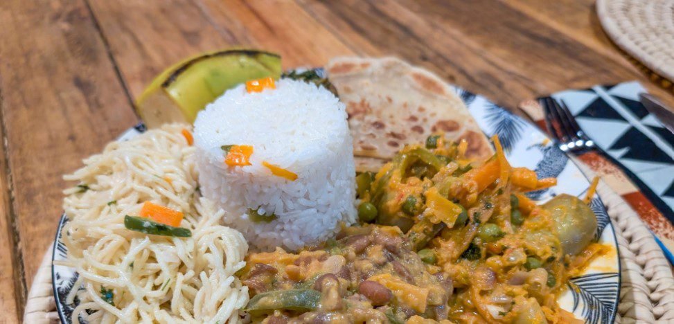 A variety of colorful vegetarian dishes made with fresh vegetables and legumes in Tanzania.